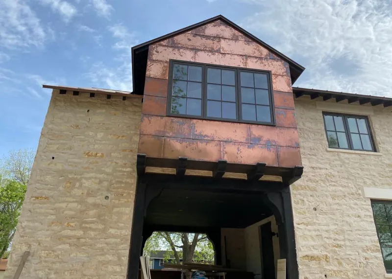 Copper metal panel facade on a stone building for Skylight Installation in Santa Rosa
